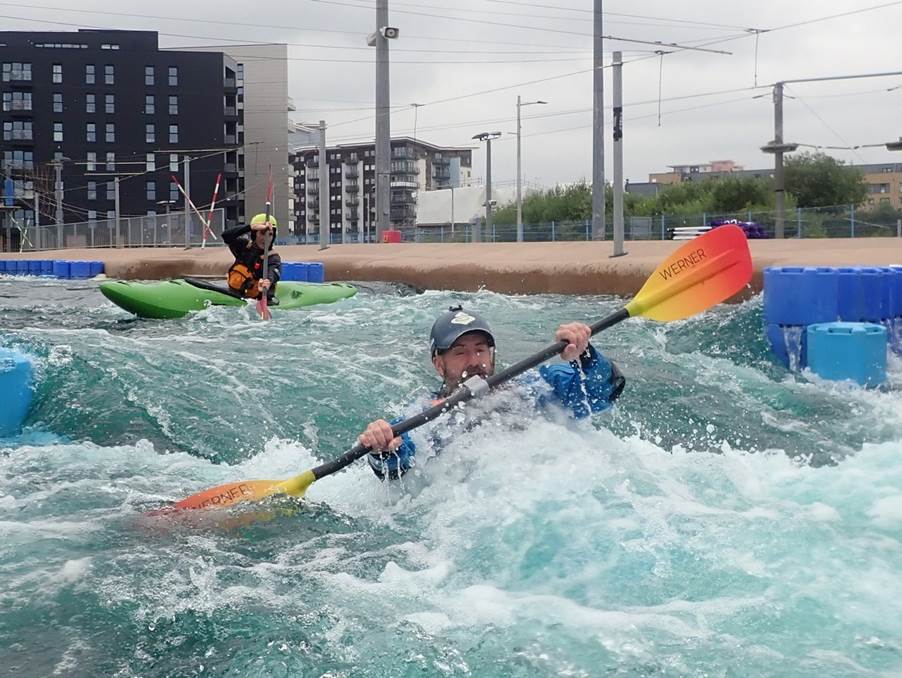 A group of people in kayaks in a river
Description automatically generated with low confidence