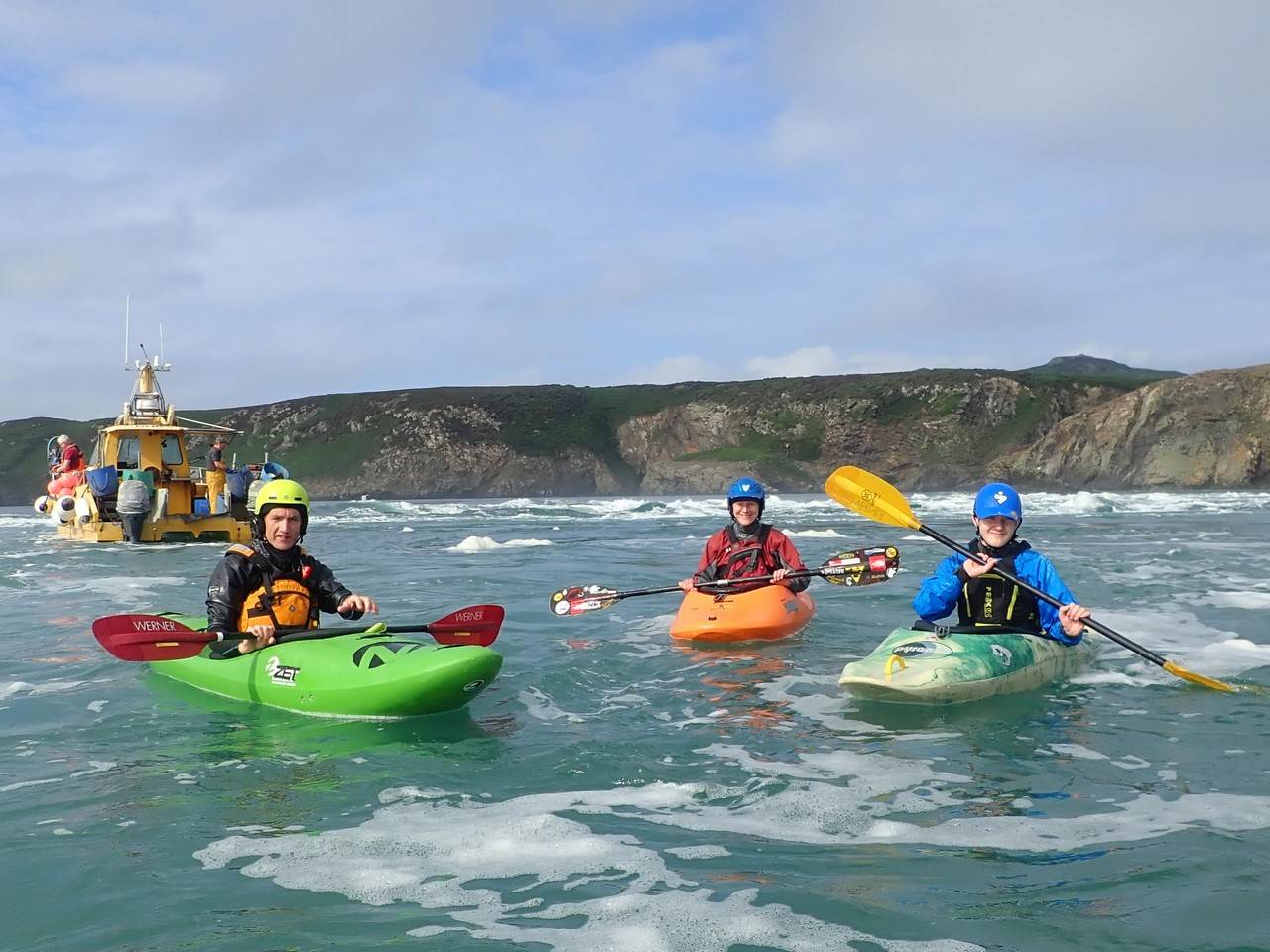 A group of people in kayaks
Description automatically generated with medium confidence