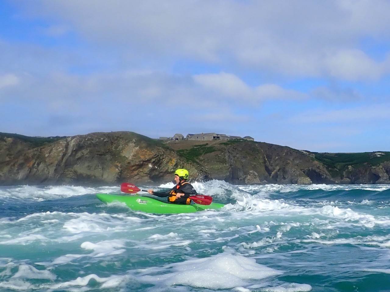 A person in a kayak in the water
Description automatically generated with low confidence