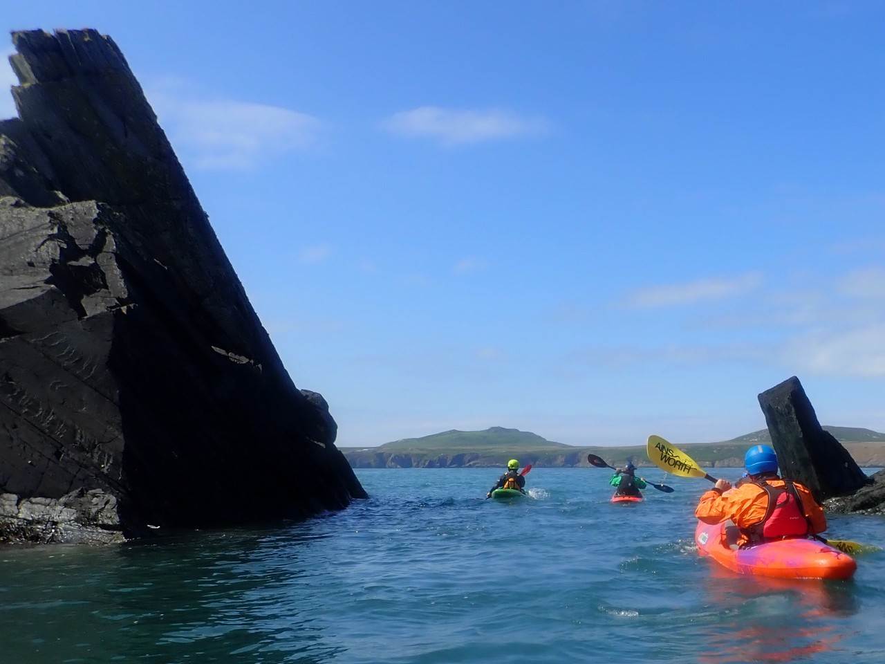 A group of people in kayaks in a body of water
Description automatically generated with medium confidence