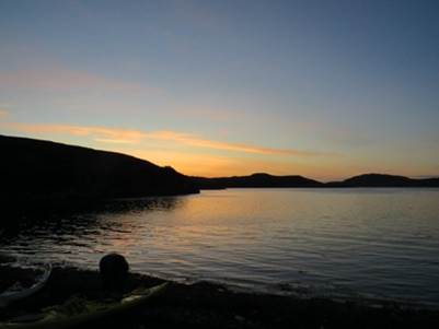 A body of water with a hill in the background

Description automatically generated with medium confidence