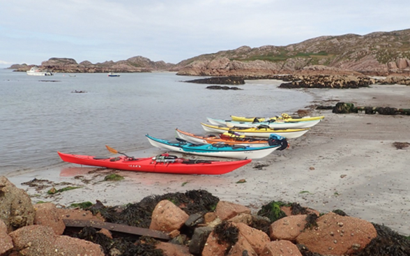 A group of boats on a beach
Description automatically generated with low confidence