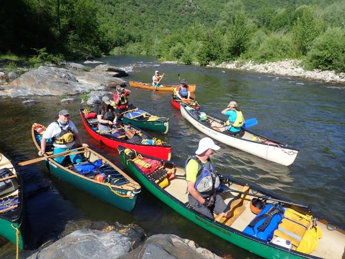 A group of people in canoes on a river

Description automatically generated with medium confidence