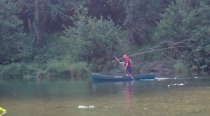 A person in a boat on a river

Description automatically generated with low confidence