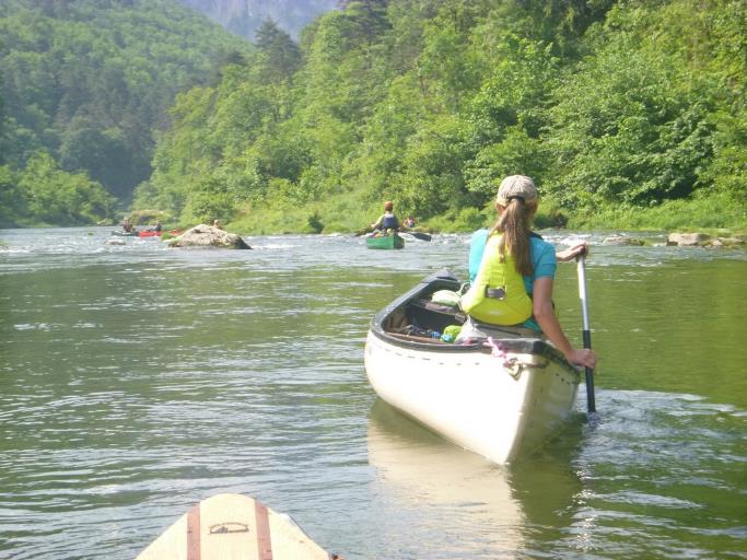 A person in a canoe on a river

Description automatically generated with low confidence