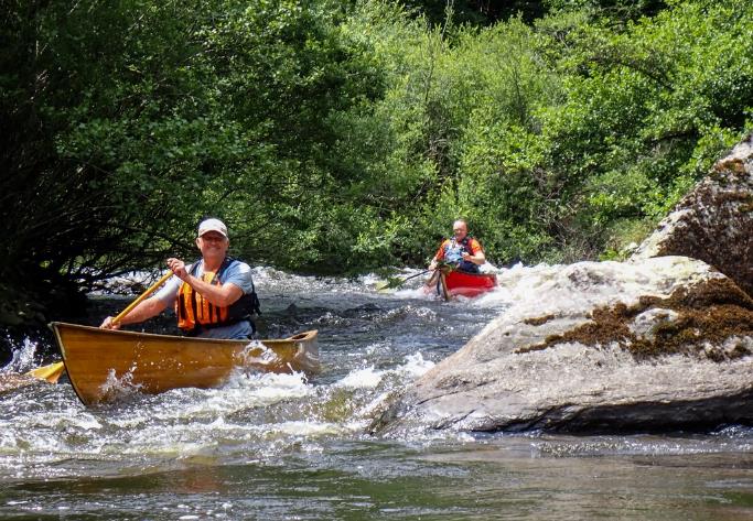A group of people in canoes on a river

Description automatically generated with low confidence