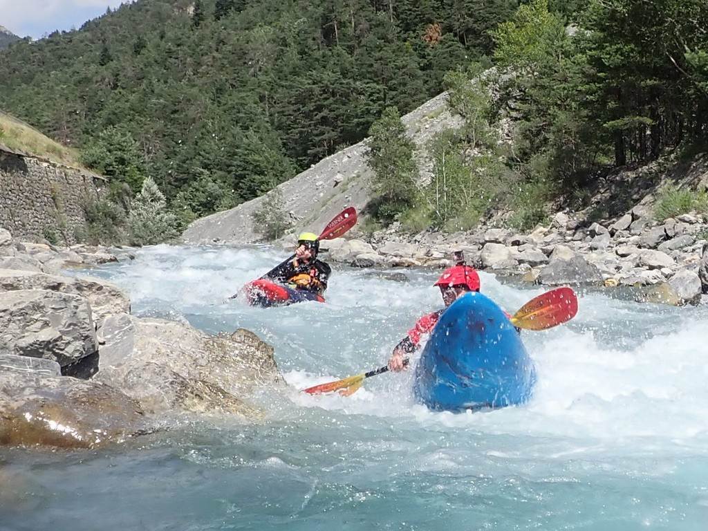 People kayaking in a river
Description automatically generated
