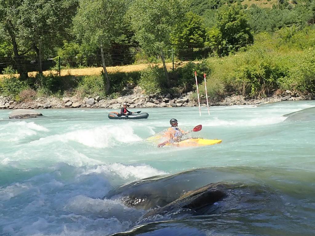 People kayaking in a river
Description automatically generated