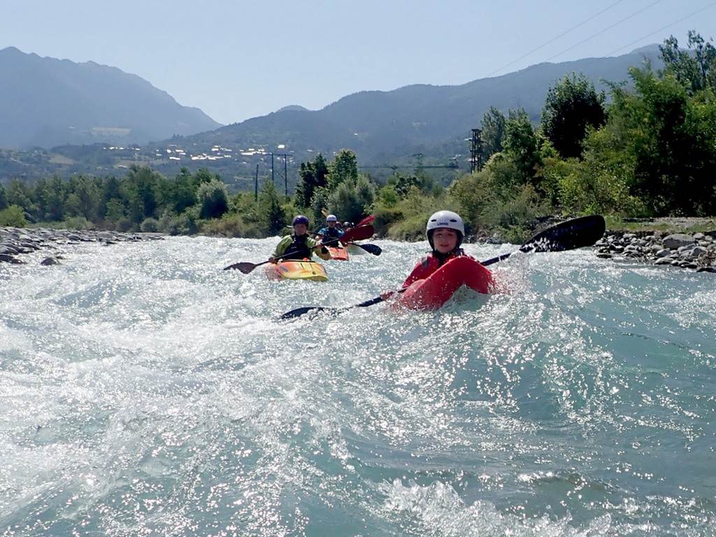 People kayaking in the river
Description automatically generated