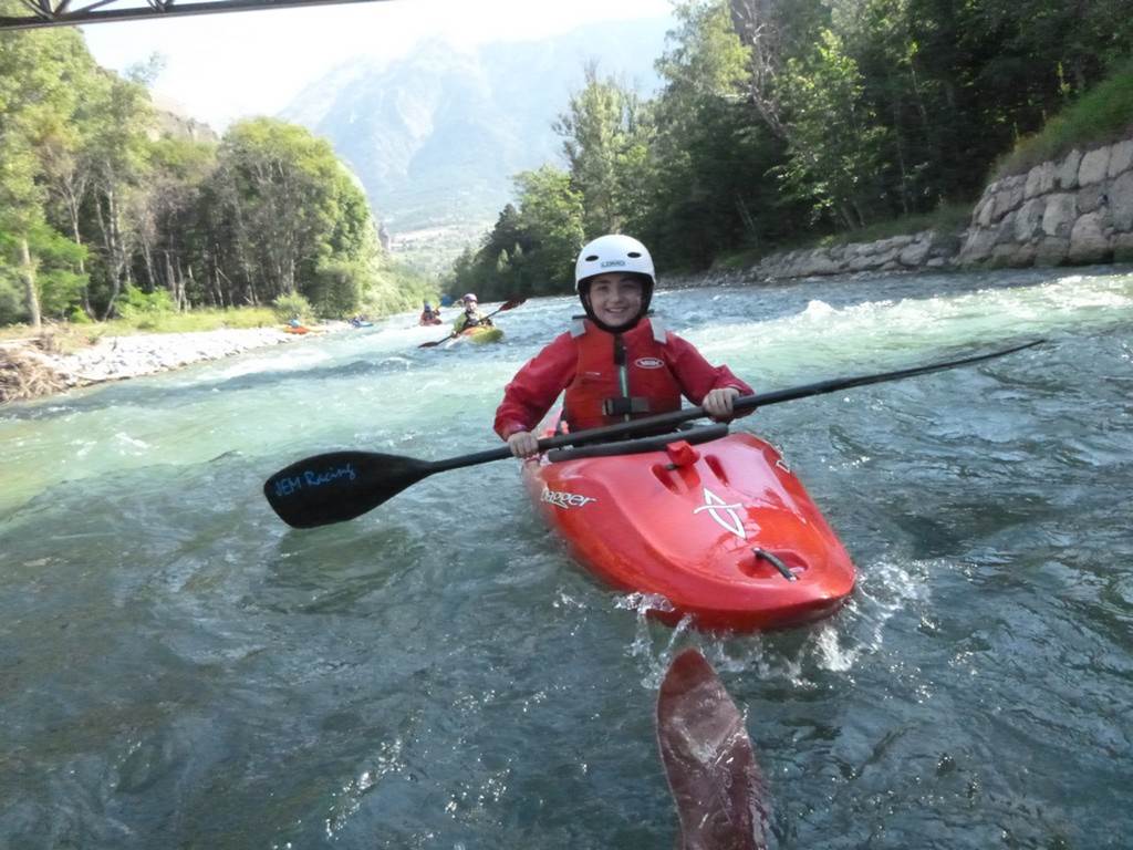 A person in a red kayak
Description automatically generated