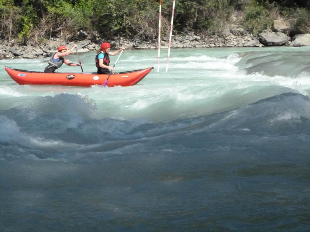 A couple of people in a raft
Description automatically generated