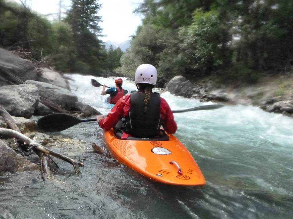 People kayaking in a river
Description automatically generated