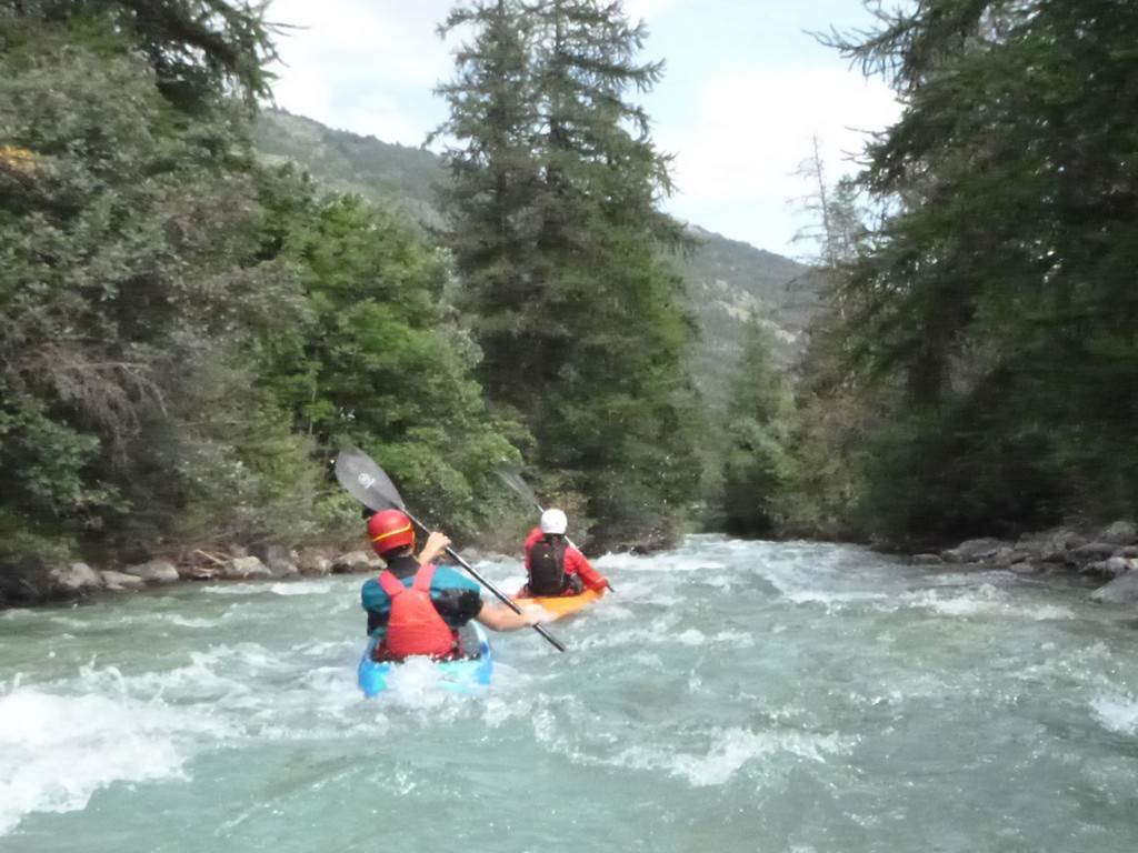 People kayaking in a river
Description automatically generated