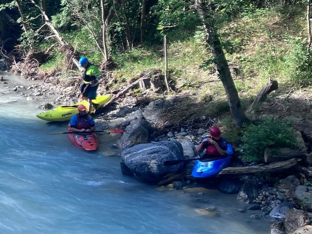 People kayaking on a river
Description automatically generated