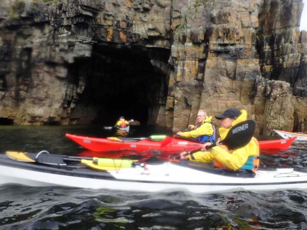People kayaking in a cave

Description automatically generated