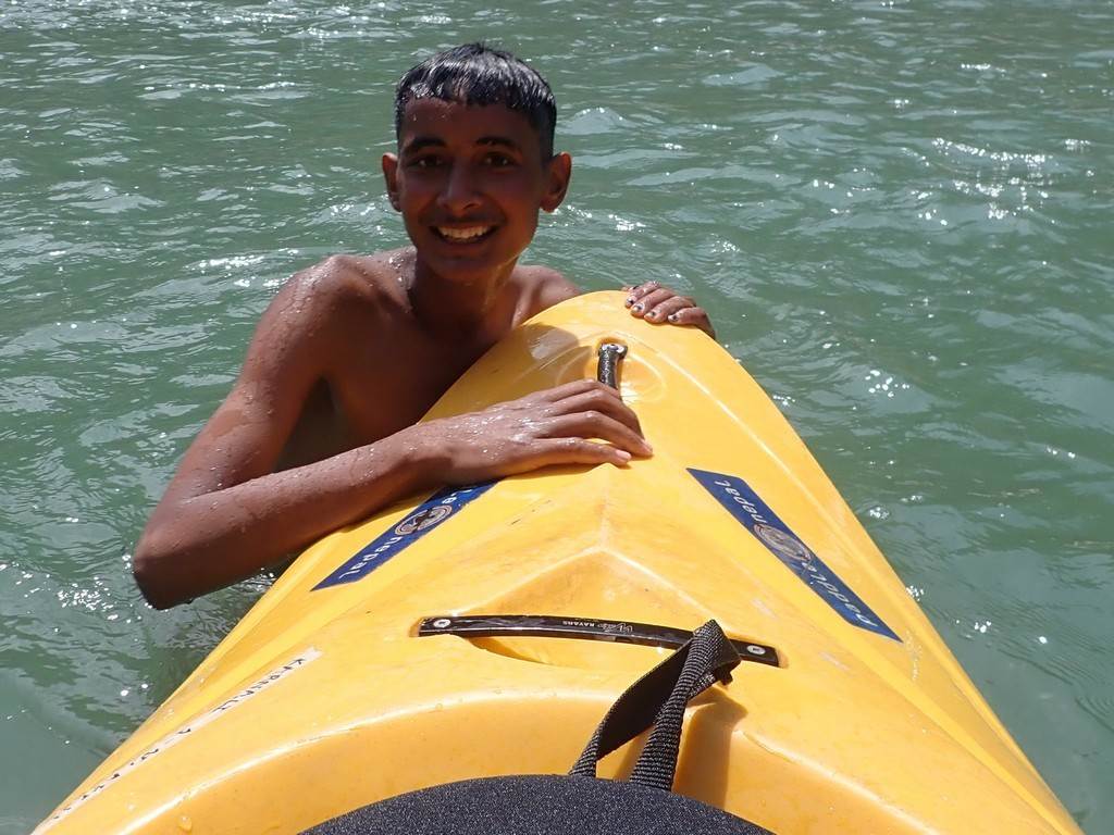 A child in a kayak

Description automatically generated