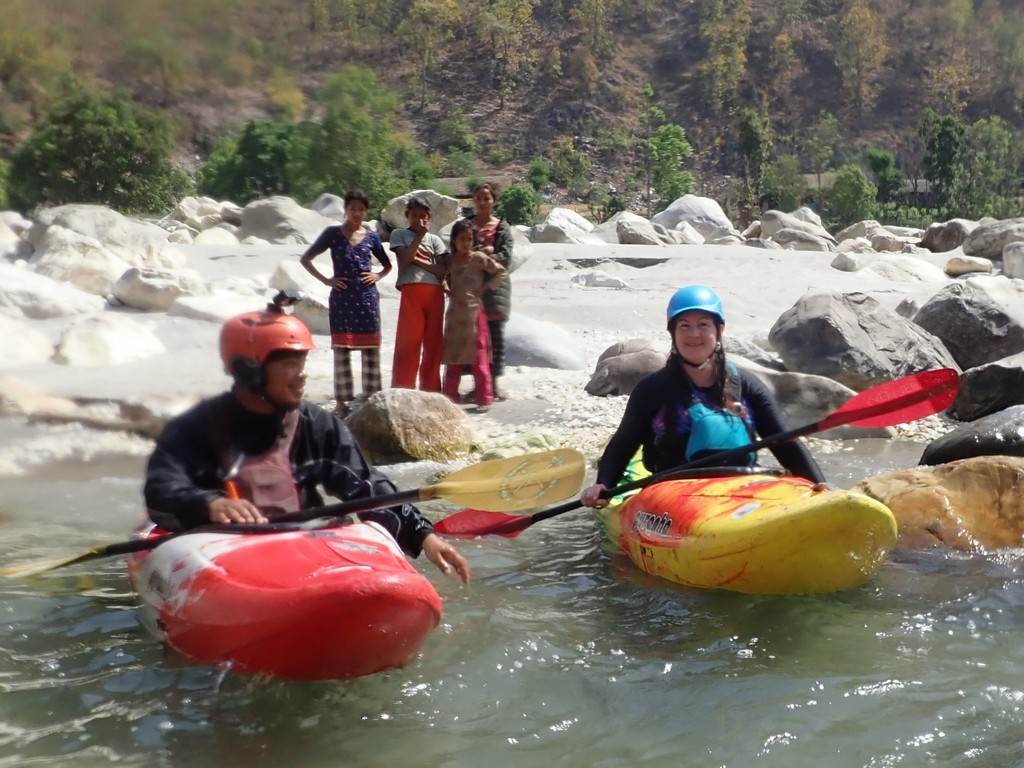 People kayaking on a river

Description automatically generated